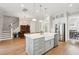 Open concept kitchen with large island, stainless steel appliances, and hardwood floors at 2313 Bucktail Ct, Mount Pleasant, SC 29466