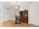 Open-concept living area features a stylish bar cabinet and staircase with wood floors at 2313 Bucktail Ct, Mount Pleasant, SC 29466