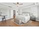 Comfortable main bedroom features hardwood floors, tray ceiling, and a charming decor at 2313 Bucktail Ct, Mount Pleasant, SC 29466