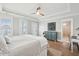 Bright main bedroom boasts tray ceiling, hardwood floors, and a unique blue cabinet at 2313 Bucktail Ct, Mount Pleasant, SC 29466