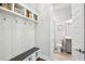 Functional mudroom with coat hooks, bench, and access to the adjacent bathroom at 2313 Bucktail Ct, Mount Pleasant, SC 29466