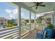 Relax on this inviting porch featuring an overhead fan and views of the surrounding neighborhood at 2313 Bucktail Ct, Mount Pleasant, SC 29466