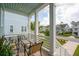 Inviting porch with comfortable seating, offering a relaxing outdoor space and views of a quaint coastal neighborhood at 2313 Bucktail Ct, Mount Pleasant, SC 29466