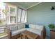 Screened-in porch offers outdoor living space with comfortable seating and views at 2313 Bucktail Ct, Mount Pleasant, SC 29466