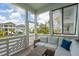 Screened-in porch offering a comfortable seating area and views of the neighborhood at 2313 Bucktail Ct, Mount Pleasant, SC 29466
