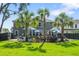 Expansive backyard featuring a pool, palm trees, and a well-maintained lawn with an inviting outdoor space at 2331 Brinkley Rd, Johns Island, SC 29455