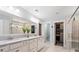 Elegant bathroom featuring a double vanity, large mirror, and walk-in shower at 2331 Brinkley Rd, Johns Island, SC 29455