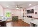 Charming bonus room featuring hardwood floors, built-in cabinets, and a window letting in natural light at 2331 Brinkley Rd, Johns Island, SC 29455