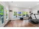 Bright home gym with pool views, hardwood floors, and exercise equipment at 2331 Brinkley Rd, Johns Island, SC 29455