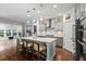 Modern kitchen featuring stainless steel appliances, a large island, and hardwood floors at 2331 Brinkley Rd, Johns Island, SC 29455
