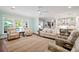 Inviting living room with stylish furnishings and view to the pool and backyard at 2331 Brinkley Rd, Johns Island, SC 29455