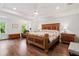 Spacious main bedroom with hardwood floors, a tray ceiling, and natural light at 2331 Brinkley Rd, Johns Island, SC 29455