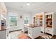 Bright home office featuring custom built-ins, large windows, and a charming desk at 2331 Brinkley Rd, Johns Island, SC 29455