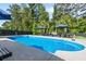 Inviting backyard pool with ample seating and lush greenery, creating a private oasis at 2331 Brinkley Rd, Johns Island, SC 29455