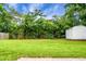 Expansive backyard featuring lush greenery and a storage shed, offering privacy and ample space at 2456 Lantern St, Charleston, SC 29414