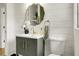 Charming bathroom with modern fixtures, shiplap walls, and a decorative mirror at 2456 Lantern St, Charleston, SC 29414