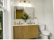 Stylish bathroom with a dual sink vanity, gold fixtures, and a neutral color scheme at 2456 Lantern St, Charleston, SC 29414