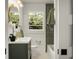Charming bathroom with modern fixtures, shiplap walls, and a decorative mirror at 2456 Lantern St, Charleston, SC 29414