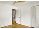 Bright bedroom featuring hardwood floors, neutral walls, closet and a ceiling fan at 2456 Lantern St, Charleston, SC 29414