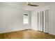 Bedroom with neutral walls, hardwood floors, large window, and bi-fold closet doors at 2456 Lantern St, Charleston, SC 29414