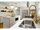 Bright kitchen with a stainless sink, stainless appliances, and open shelving at 2456 Lantern St, Charleston, SC 29414