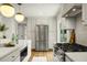Bright kitchen featuring stainless steel appliances, white cabinetry, and modern lighting at 2456 Lantern St, Charleston, SC 29414