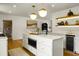 Modern kitchen featuring an island with a microwave and an attached dining area at 2456 Lantern St, Charleston, SC 29414