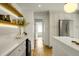 Modern kitchen featuring stainless appliances, a wine fridge, and open shelving at 2456 Lantern St, Charleston, SC 29414