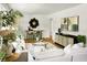 Airy living room featuring hardwood floors, decorative furniture, and contemporary art pieces at 2456 Lantern St, Charleston, SC 29414