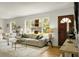 Bright living room featuring hardwood floors and large window showcasing greenery at 2456 Lantern St, Charleston, SC 29414