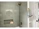 Stylish shower with gray tile, gold fixtures, and built-in niche at 2456 Lantern St, Charleston, SC 29414