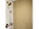 Close up of shower with gray tile and built in storage at 2456 Lantern St, Charleston, SC 29414