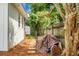 Grassy side yard featuring a stone pathway, pine straw and partial fencing at 2456 Lantern St, Charleston, SC 29414
