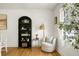 Cozy sitting area featuring an arched bookcase, a comfortable swivel chair, and natural light at 2456 Lantern St, Charleston, SC 29414