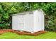 A well-maintained storage shed sits amidst trees, offering practical outdoor storage at 2456 Lantern St, Charleston, SC 29414