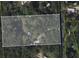 Aerial view of wooded property with pond and house featuring a swimming pool in the backyard at 2494 Cape Rd, Johns Island, SC 29455