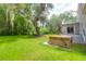 Secluded backyard featuring a hot tub and mature trees at 2494 Cape Rd, Johns Island, SC 29455