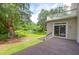 Backyard featuring a deck, lush greenery, and tranquil pond views at 2494 Cape Rd, Johns Island, SC 29455
