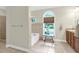 Bathroom with tub-shower combo, decorative window, and spacious layout, creating a comfortable and stylish area at 2494 Cape Rd, Johns Island, SC 29455