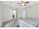 Bright bedroom features a ceiling fan, and multiple doorways, offering lots of space to enjoy at 2494 Cape Rd, Johns Island, SC 29455