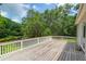 Spacious wooden deck with a white railing overlooking the landscaped backyard at 2494 Cape Rd, Johns Island, SC 29455