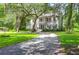 Charming home with a manicured lawn and mature trees at 2494 Cape Rd, Johns Island, SC 29455