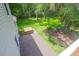A covered hot tub sits on a wooden deck, overlooking the verdant backyard of this home at 2494 Cape Rd, Johns Island, SC 29455