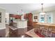 Spacious kitchen and breakfast nook featuring hardwood floors, a kitchen island with barstool seating, and stainless steel appliances at 2494 Cape Rd, Johns Island, SC 29455