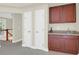 Basement kitchenette featuring dark wood cabinets and a sink at 2494 Cape Rd, Johns Island, SC 29455
