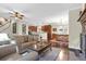 Open-concept living room with hardwood floors and a view of the kitchen and dining area at 2494 Cape Rd, Johns Island, SC 29455