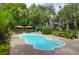 Inviting kidney-shaped pool surrounded by landscaped patio and lounge area for outdoor enjoyment at 2494 Cape Rd, Johns Island, SC 29455
