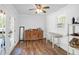 Bright, clean bonus room with wood floors, natural light, and vintage furniture at 2494 Cape Rd, Johns Island, SC 29455