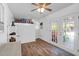 Bright room featuring wood floors, a ceiling fan, and access to outside at 2494 Cape Rd, Johns Island, SC 29455