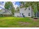 Spacious backyard with a lush lawn, patio set, and privacy fence, perfect for outdoor enjoyment at 2538 Wayne Scott Ct, Charleston, SC 29414